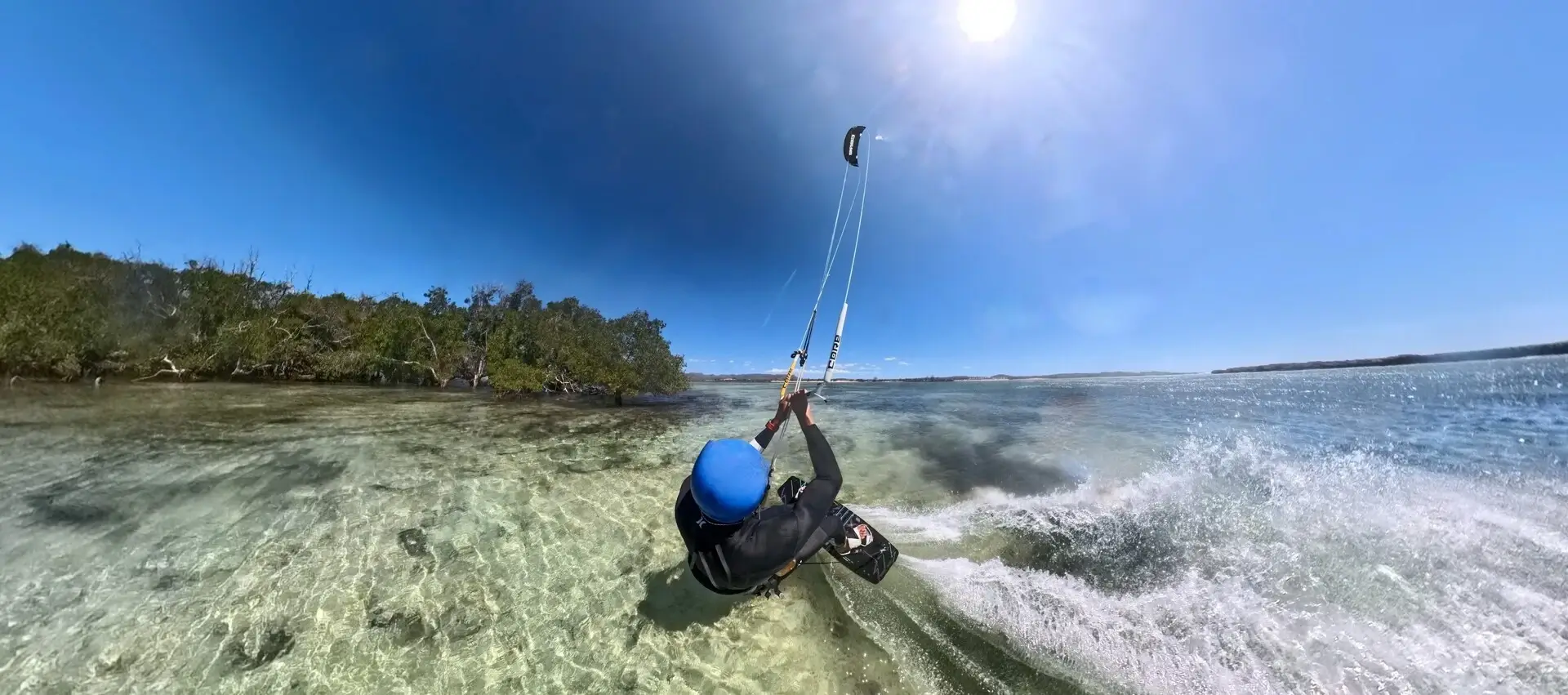 A person kiteboarding on the ocean