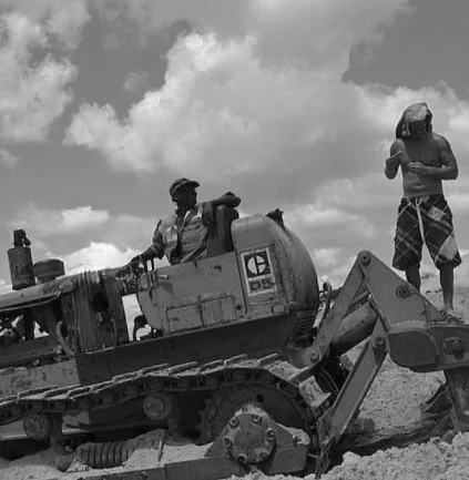 Two workers on a bulldozer